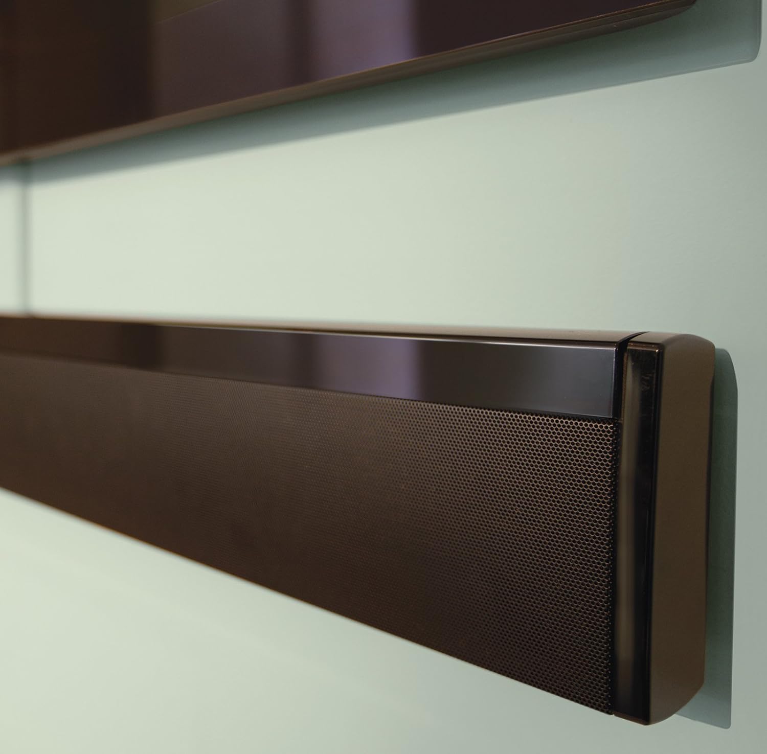Bose CineMate 1 SR soundbar wall-mounted beneath a television