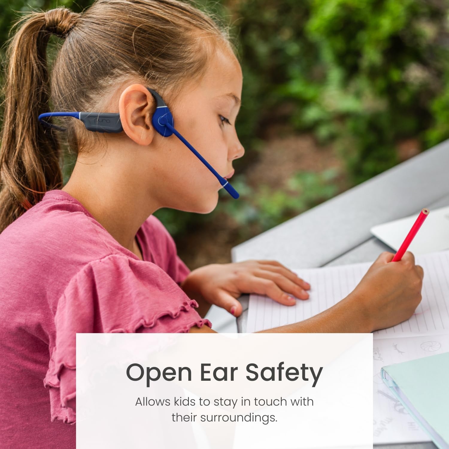 Child wearing PuroFlex headphones, emphasizing open ear safety