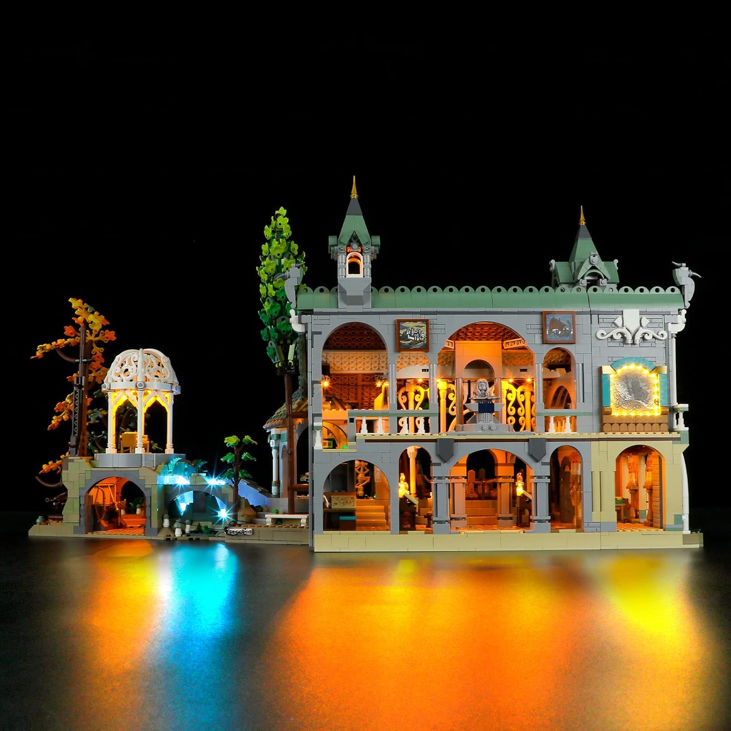 Front-left view of the illuminated LEGO 10316 Rivendell model with BRIKSMAX LED lights.