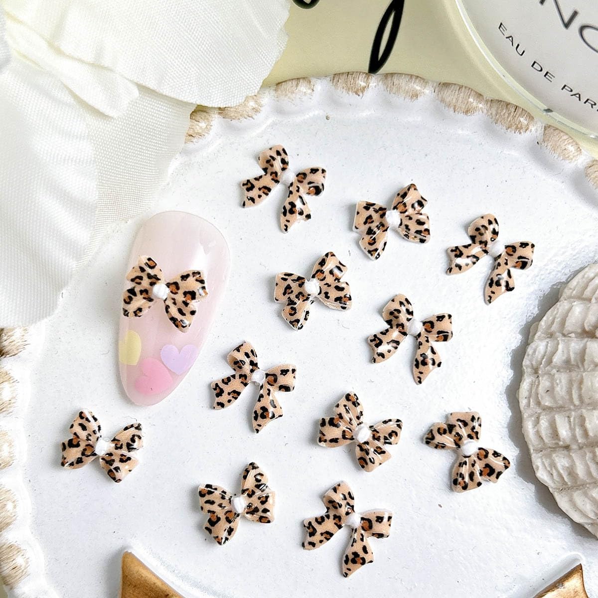 100Pcs 3D Leopard Print Bow Nail Charms Mini Resin Ribbon Nail Art Charms Decorations Spotted Pattern Nail Accessories Colorful Bow Craft Nail Supplies for Women Manicure Solon DIY