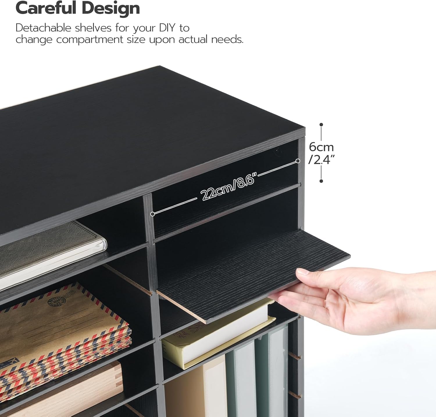 A hand demonstrating how to remove a horizontal shelf from a compartment to adjust its size.