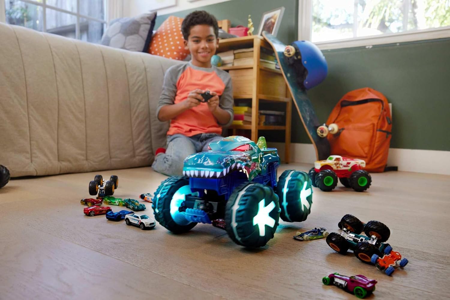 Young boy playing with Hot Wheels Mega-Wrex Alive RC and remote control