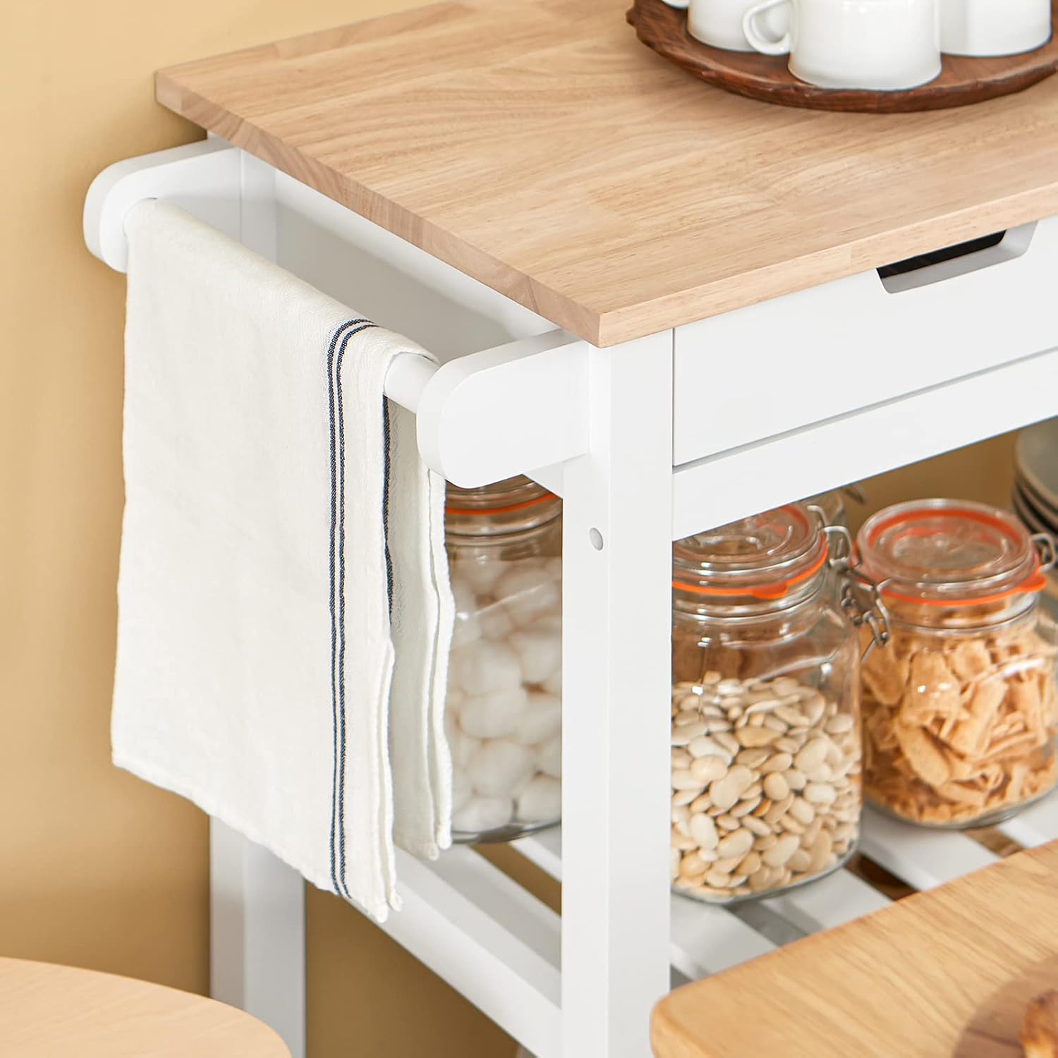 Close-up of the towel rail on the SoBuy FKW68-WN Kitchen Cart with a towel hanging