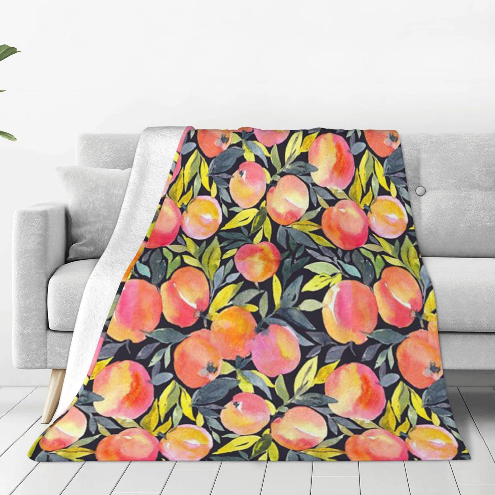 Couverture micro polaire pêche cocooning pour des soirées douillettes au salon