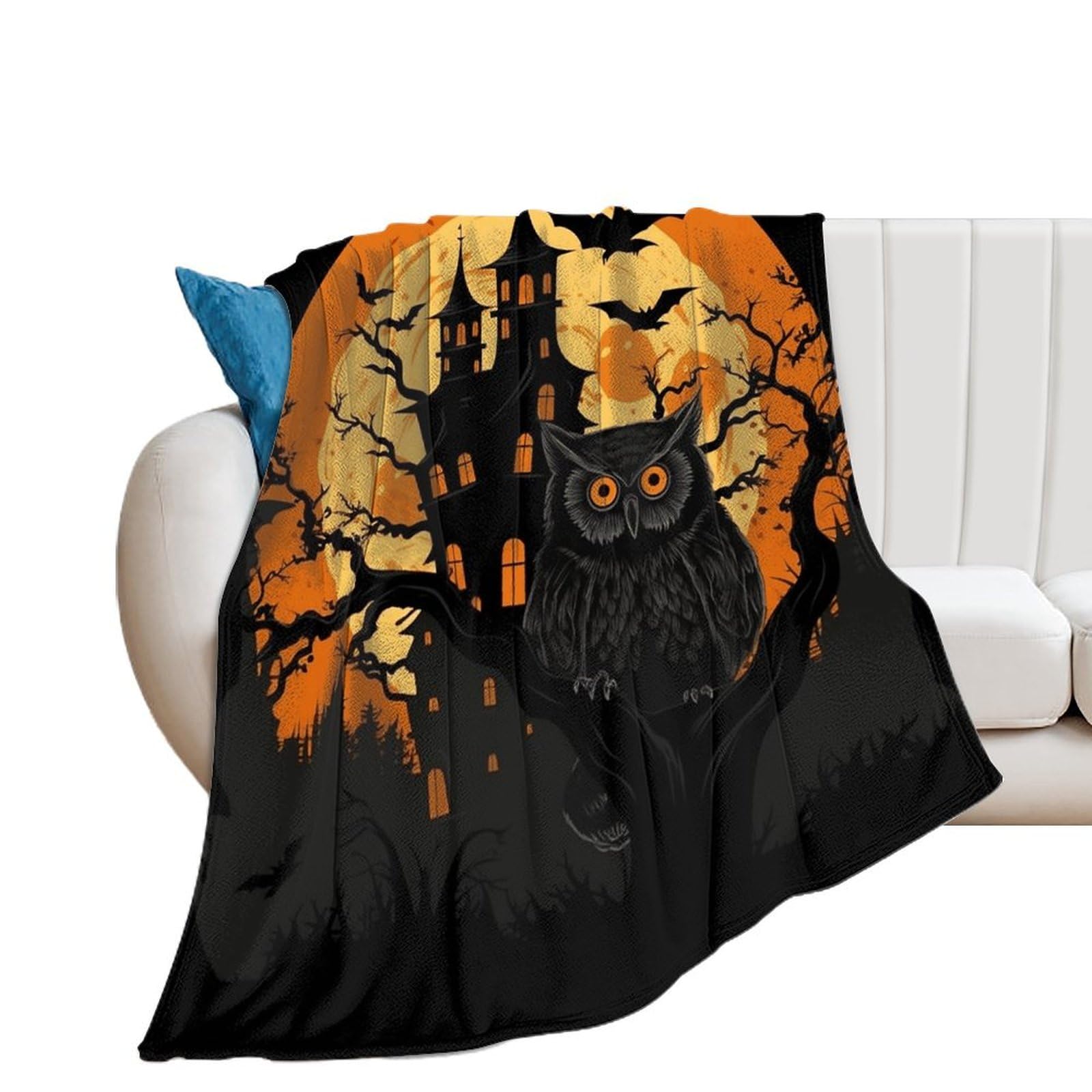 Grande couverture flanelle douce motif arbre et château sur canapé