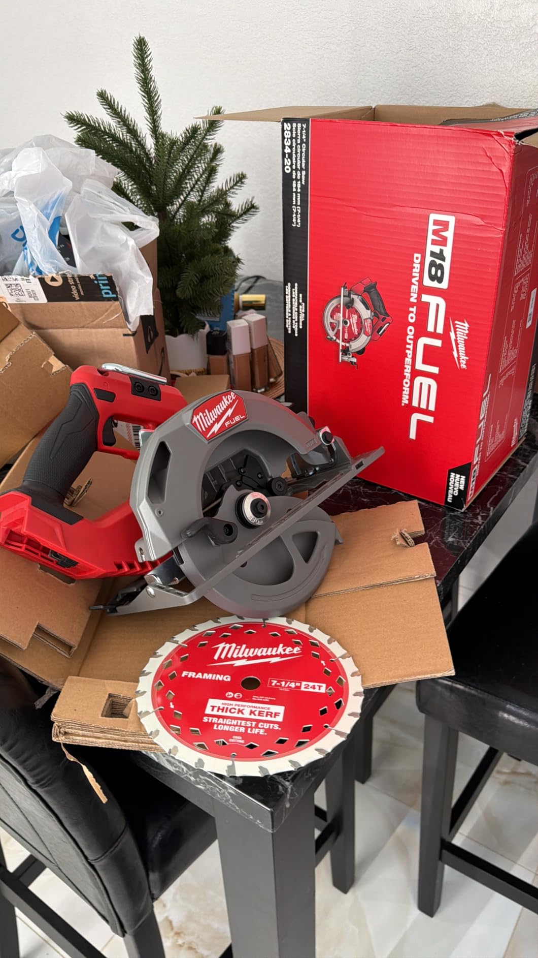 Milwaukee circular saw sitting on a wood workbench