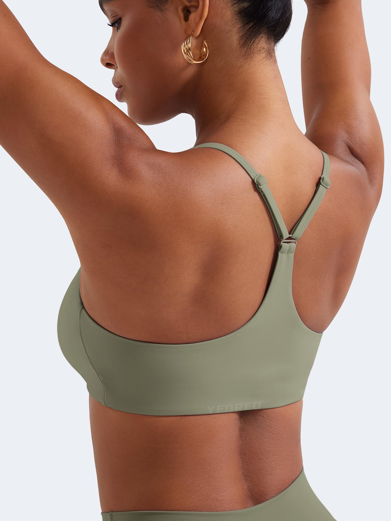 Close-up of the YEOREO Y Back Sports Bra showing the adjustable strap mechanism and V-neckline.