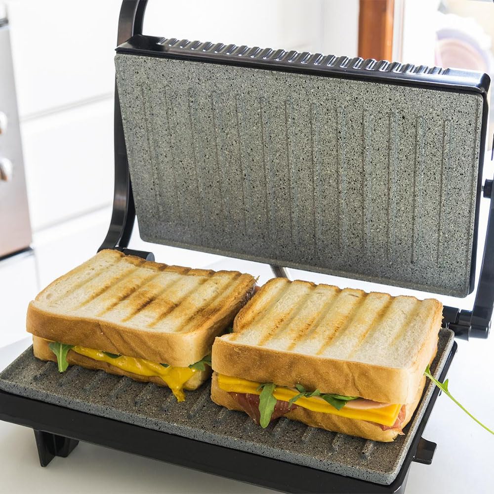 Cecotec Griglia elettrica con Grill Rock'n Grill. 700 W, superficie 23 x 14,5 cm, RockStone antiaderente, senza PTFE, PFOA, piastra galleggiante, maniglia fredda al tatto, indicatore luminoso