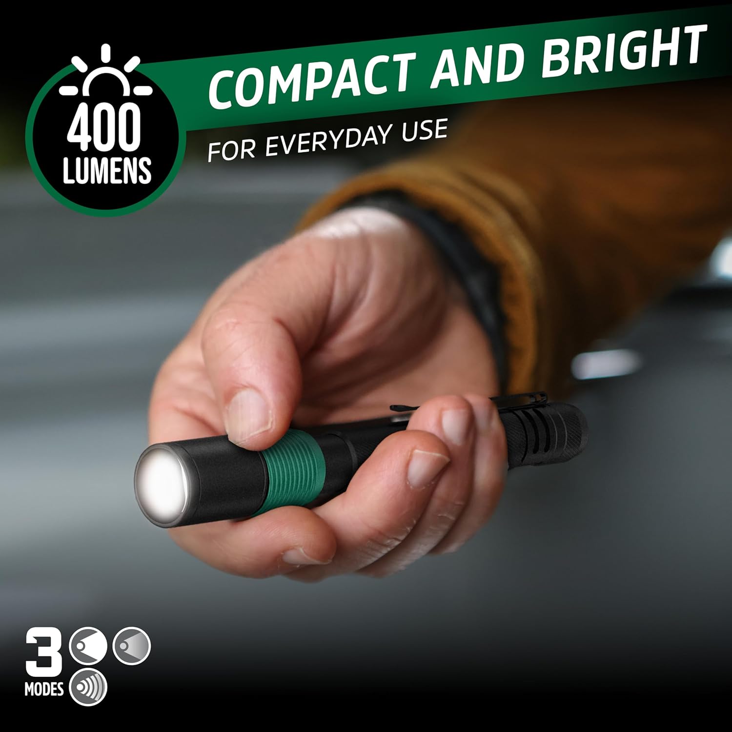 Hand holding an illuminated Energizer X-400 Pen Light