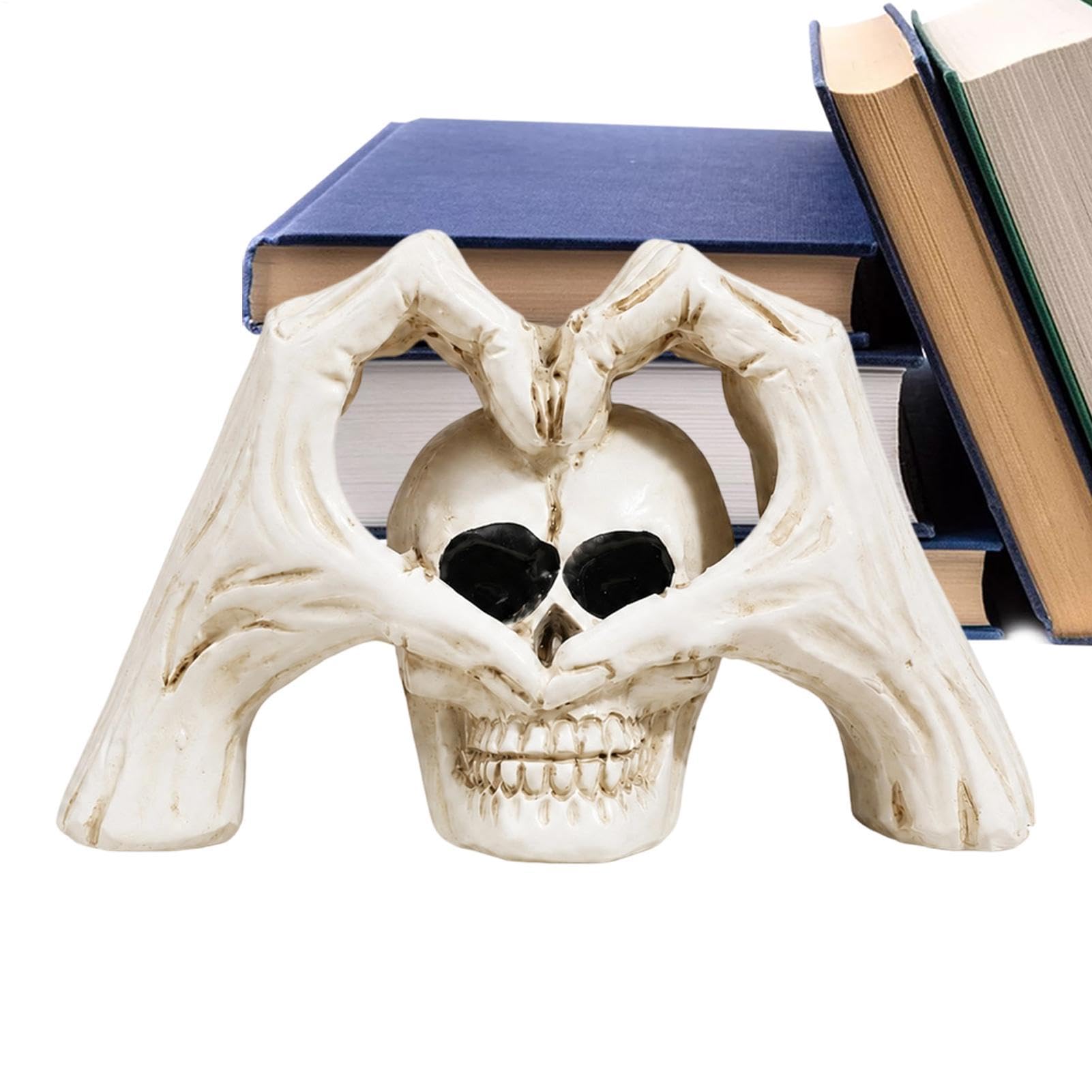 Decoración de calavera de Halloween con mano esqueleto y corazón para mesa