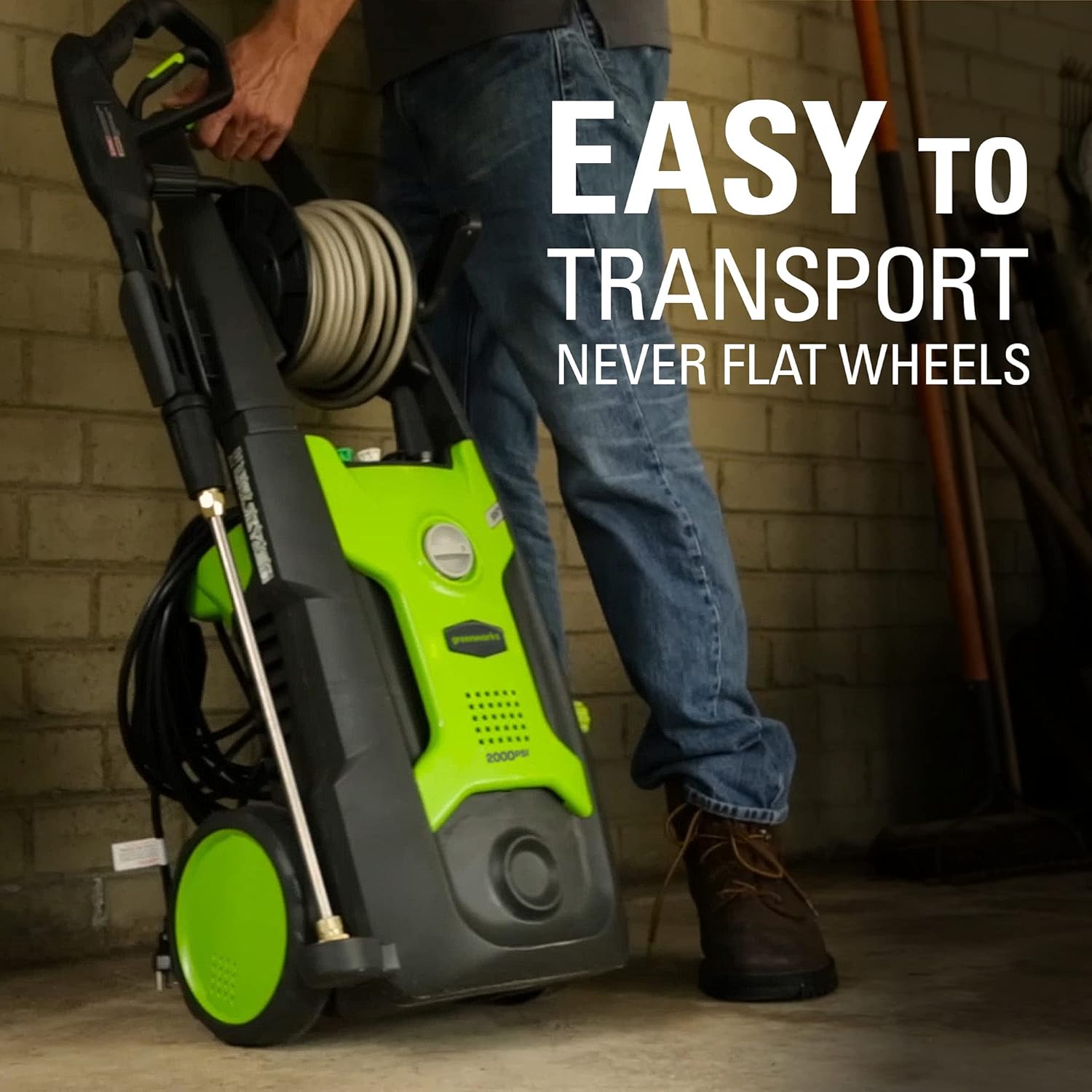 Person pulling the Greenworks pressure washer by its handle