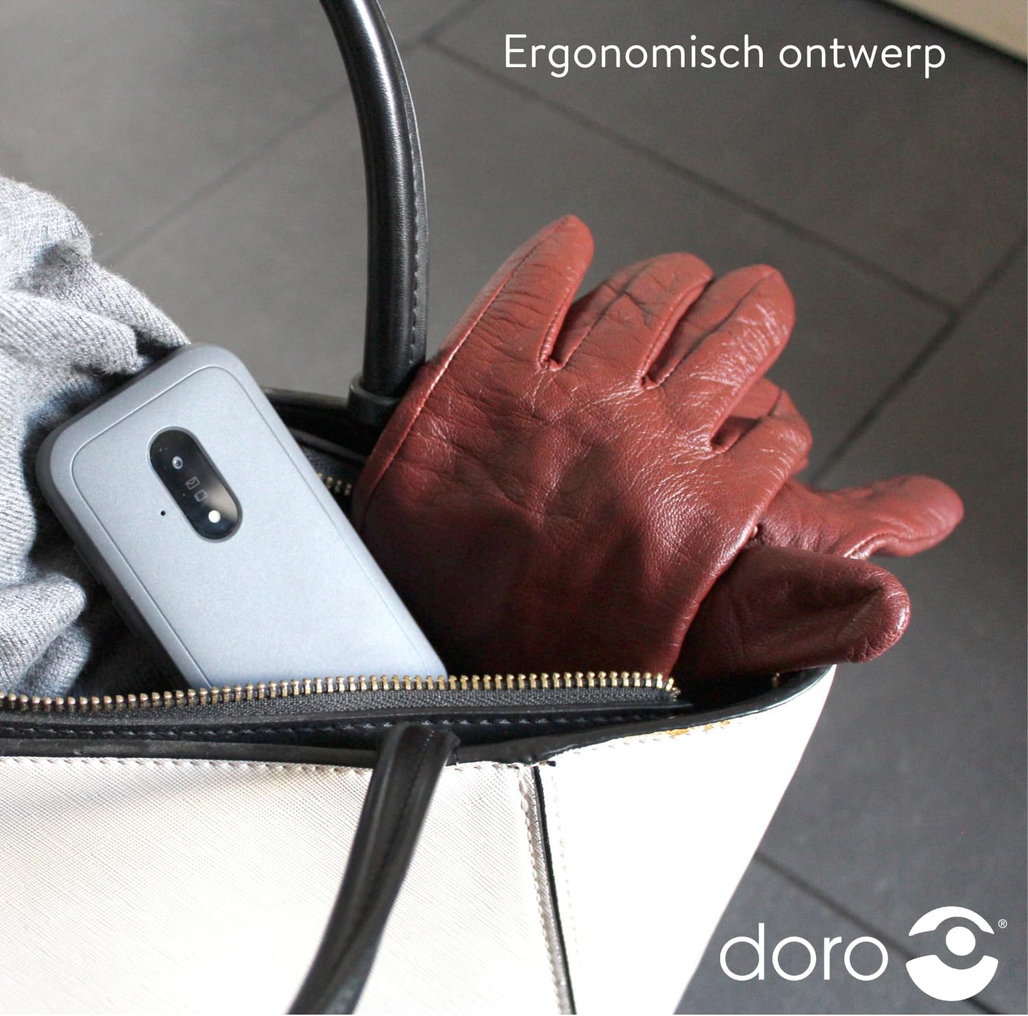 Doro Leva E20 phone in a handbag, demonstrating its compact and ergonomic design for portability.