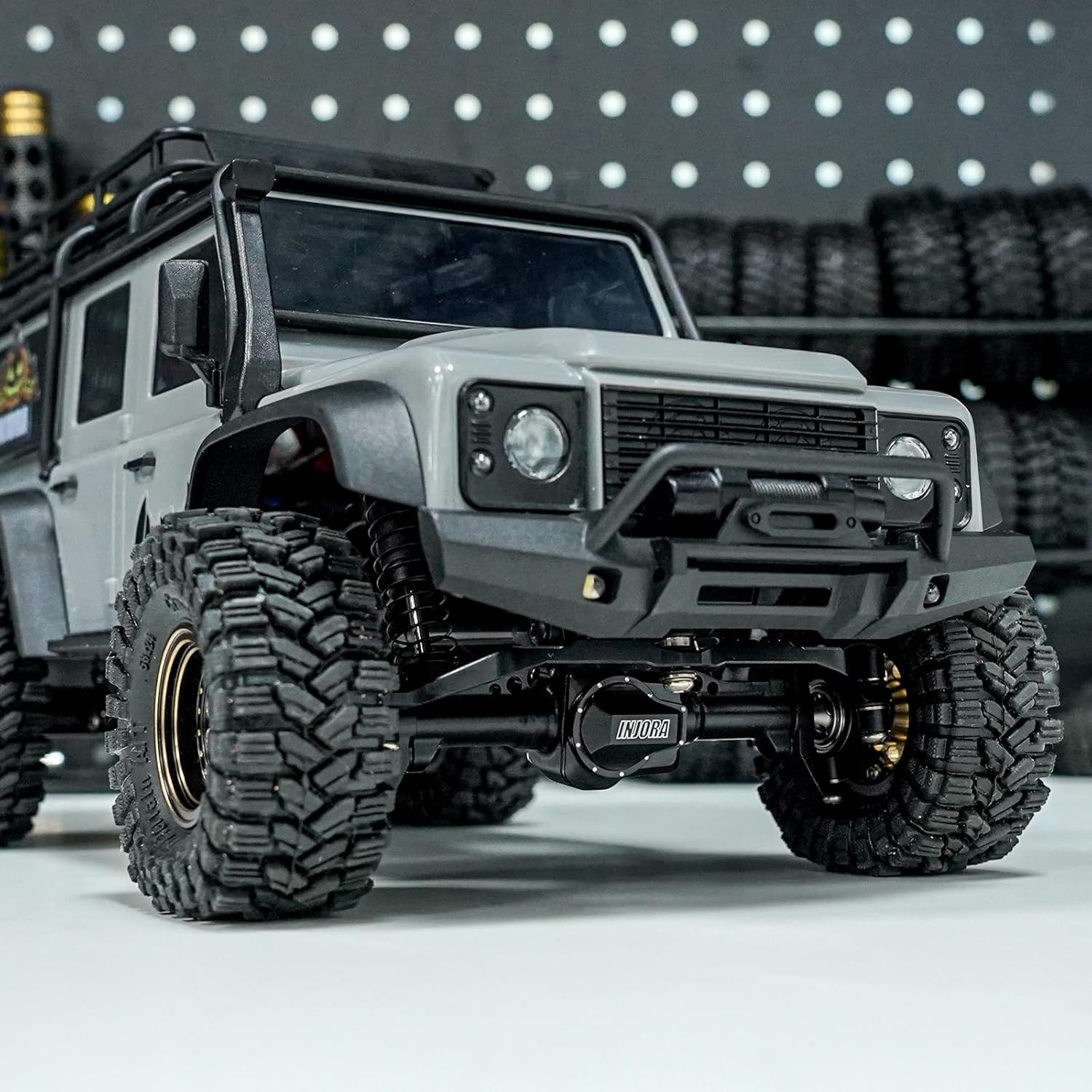 INJORA Extended 4mm CNC Aluminum Front Axle installed on a TRX4M RC Crawler