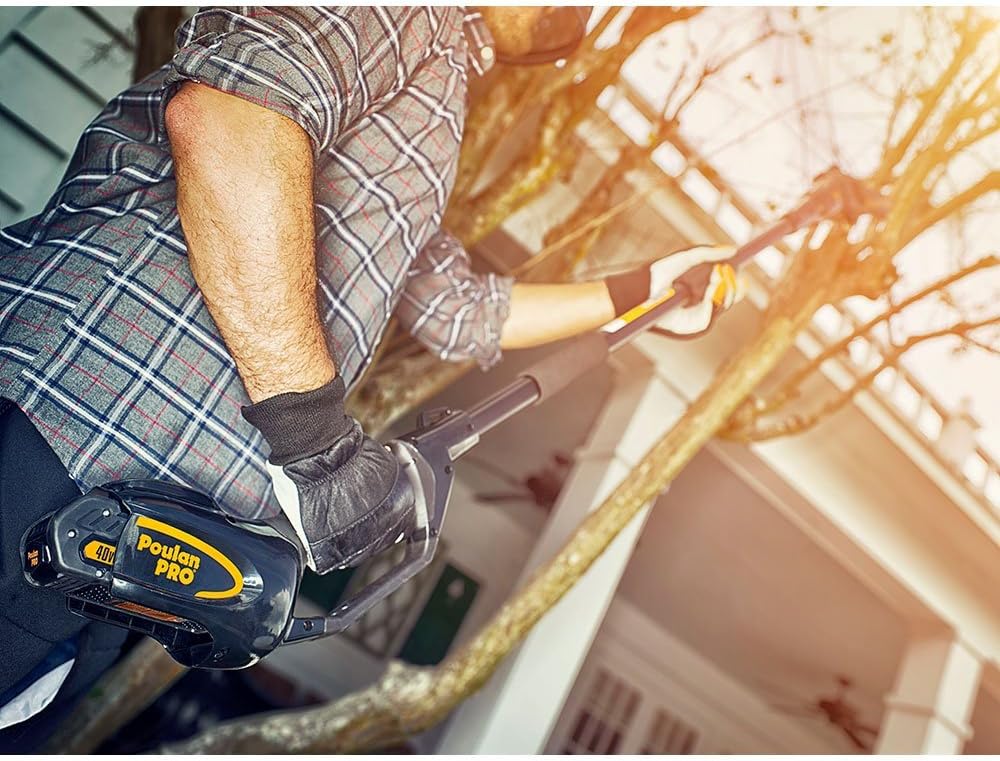 User installing battery into Poulan Pro pole saw