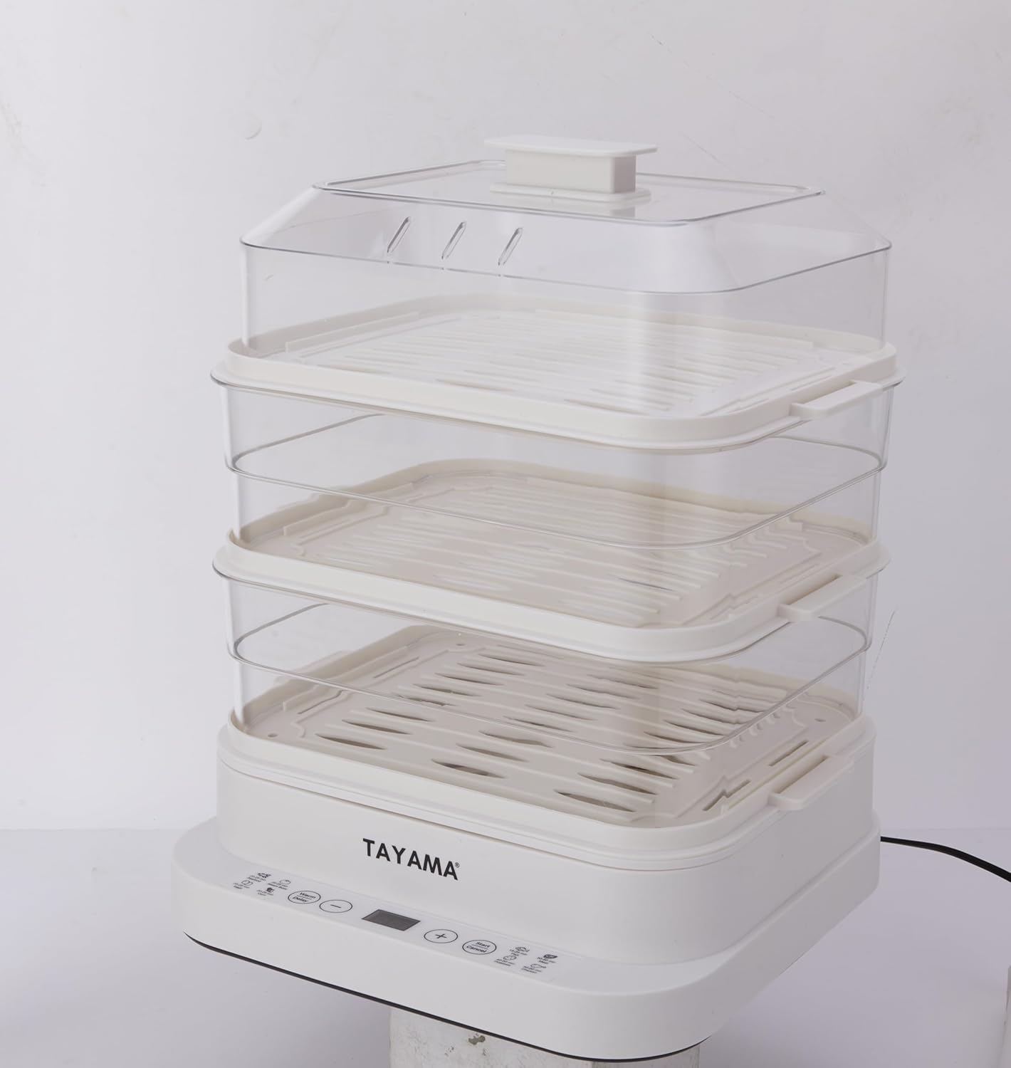 belakang view of the Tayama 3-Tier Electric Food Steamer, showing the power cord and water reservoir access.