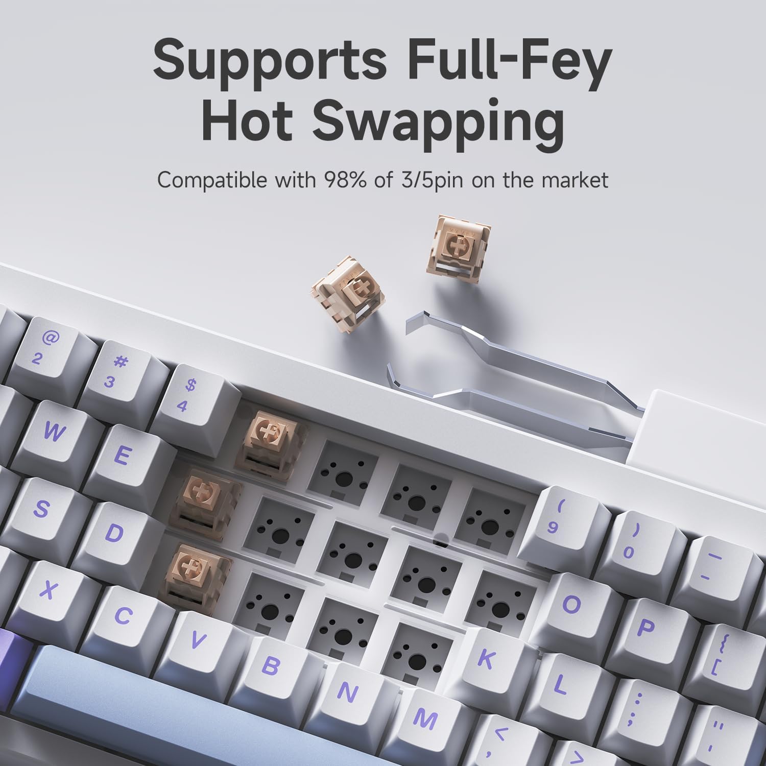 Close-up of hot-swappable switches being removed from the AJAZZ AK650 keyboard