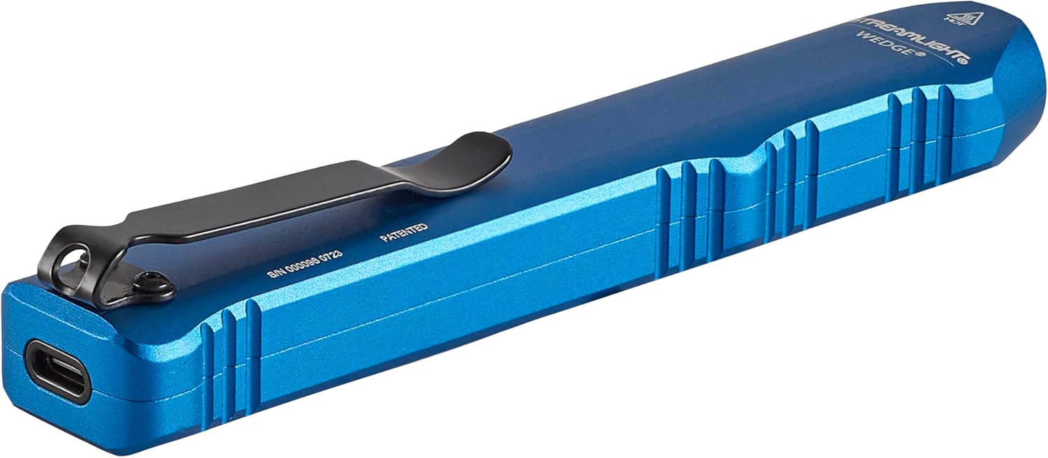 Hand holding Streamlight Wedge flashlight, demonstrating operation