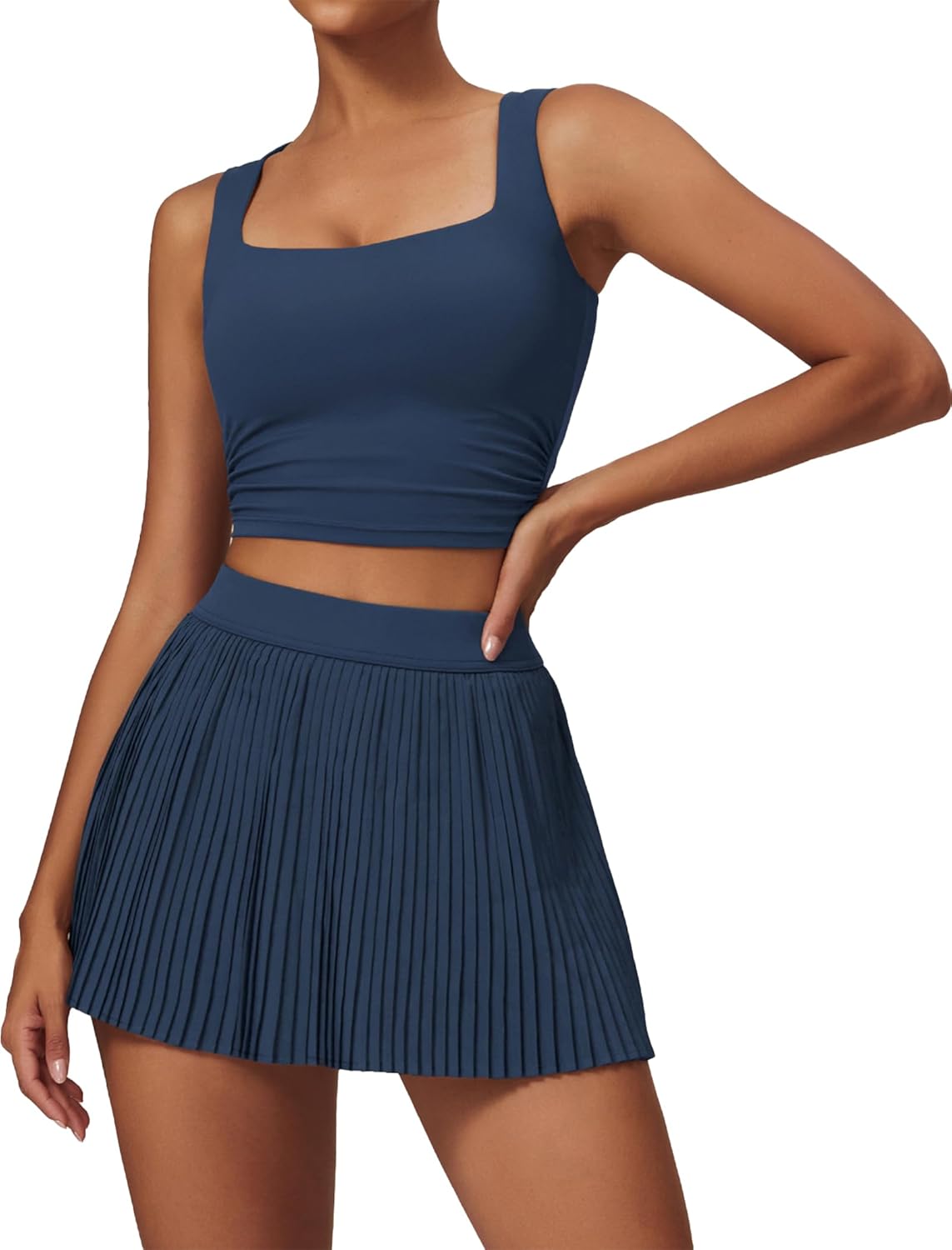 Two piece tennis dresses with high waisted pleated skirts.
