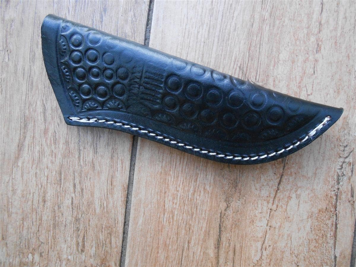 TO CLEAR! Hand made, and hand tooled pattern - heavy duty leather knife sheath. Will take most camping, bushcraft and hunting knives up to 9.5 inches long.