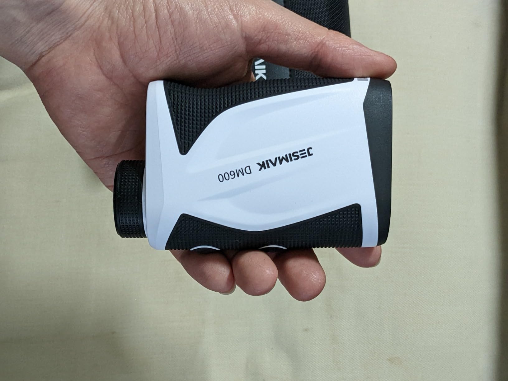 JESIMAIK DM600 Rangefinder showing the physical slope ON/OFF switch