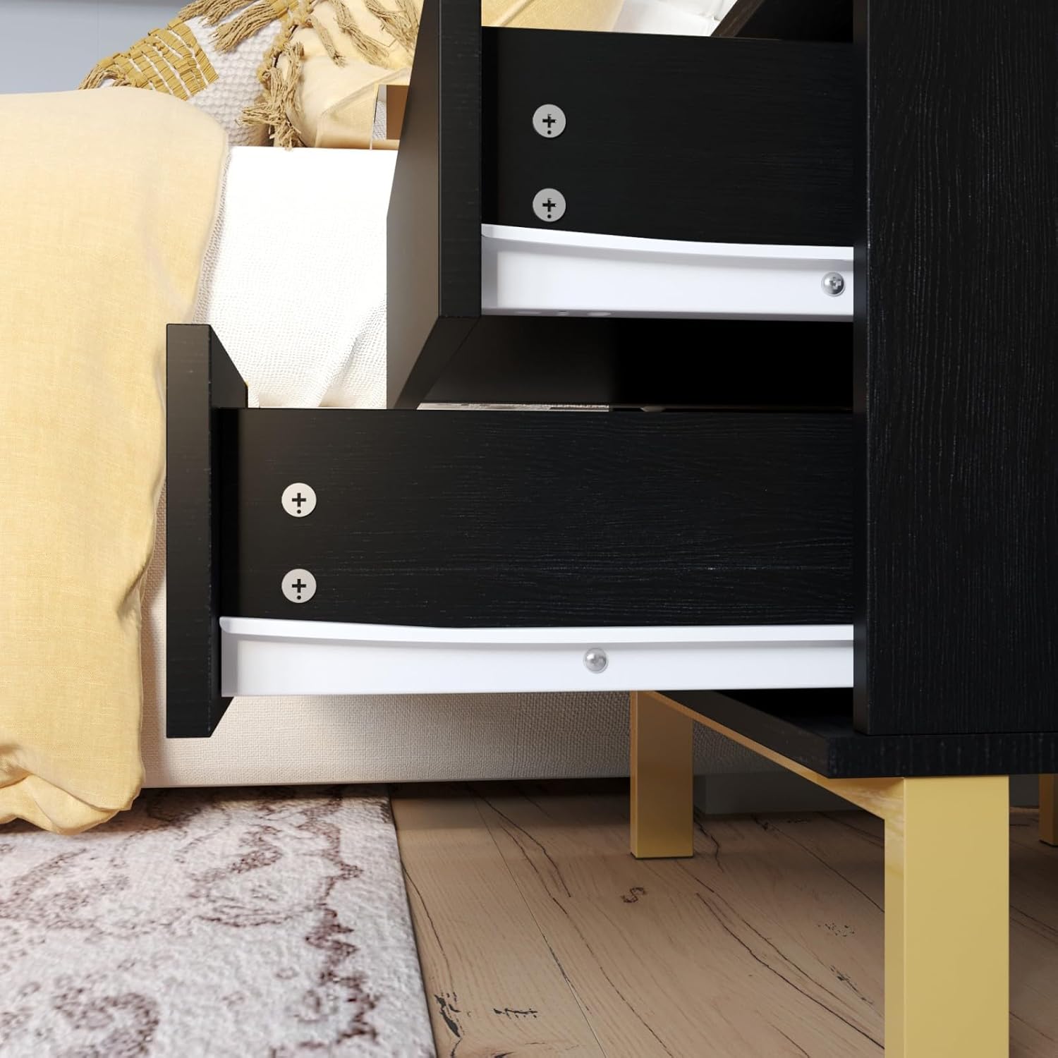 Close-up of the gold handles on the nightstand drawers