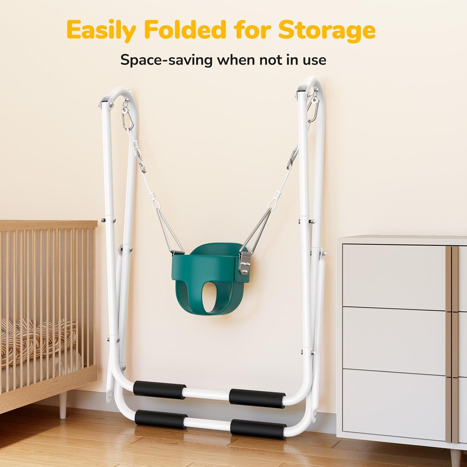 Hapfan Toddler Swing with Stand folded and leaning against a wall next to a crib, demonstrating its space-saving storage capability.