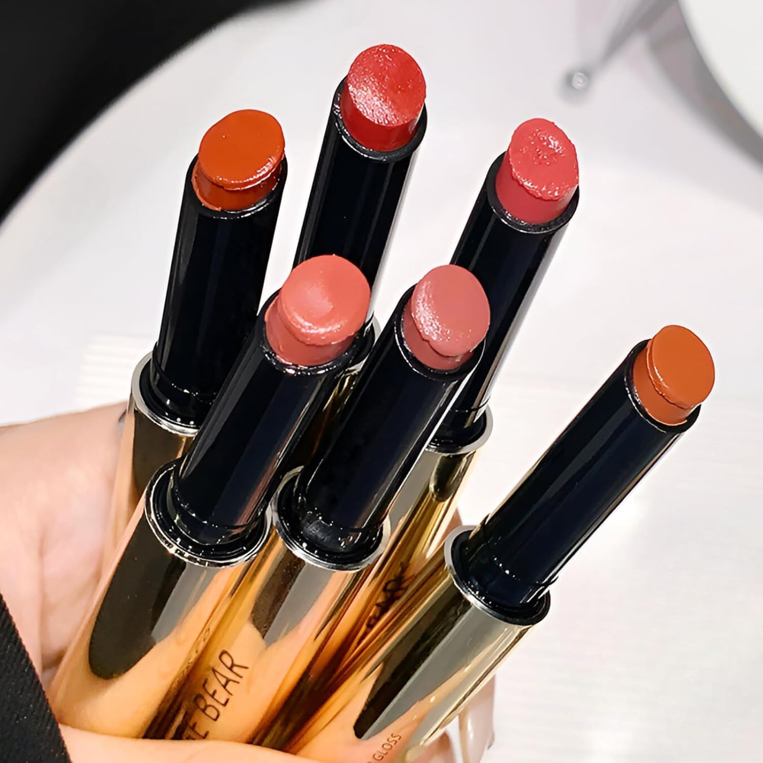 Gege Bear Holding Light Solid Lip Gloss | Gold Press Design Packaging | Non-Transfer Waterproof Creamy Glossy Lipstick | Light Pink Coral Orange Brown Tones Shade | Long-Lasting Lip Glaze Non-Sticky Formula | Transfer-Proof Perfect for Women Gen Z Teen Girls (05# Gray Powder, 2g)