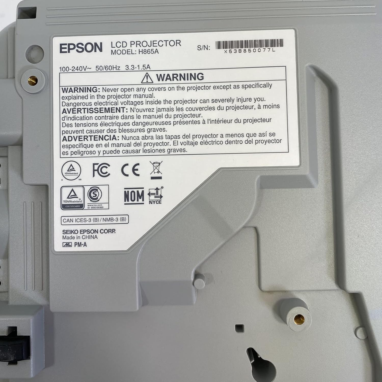 Bottom label of Epson PowerLite 970 projector showing model number H865A and serial number X53B850077L