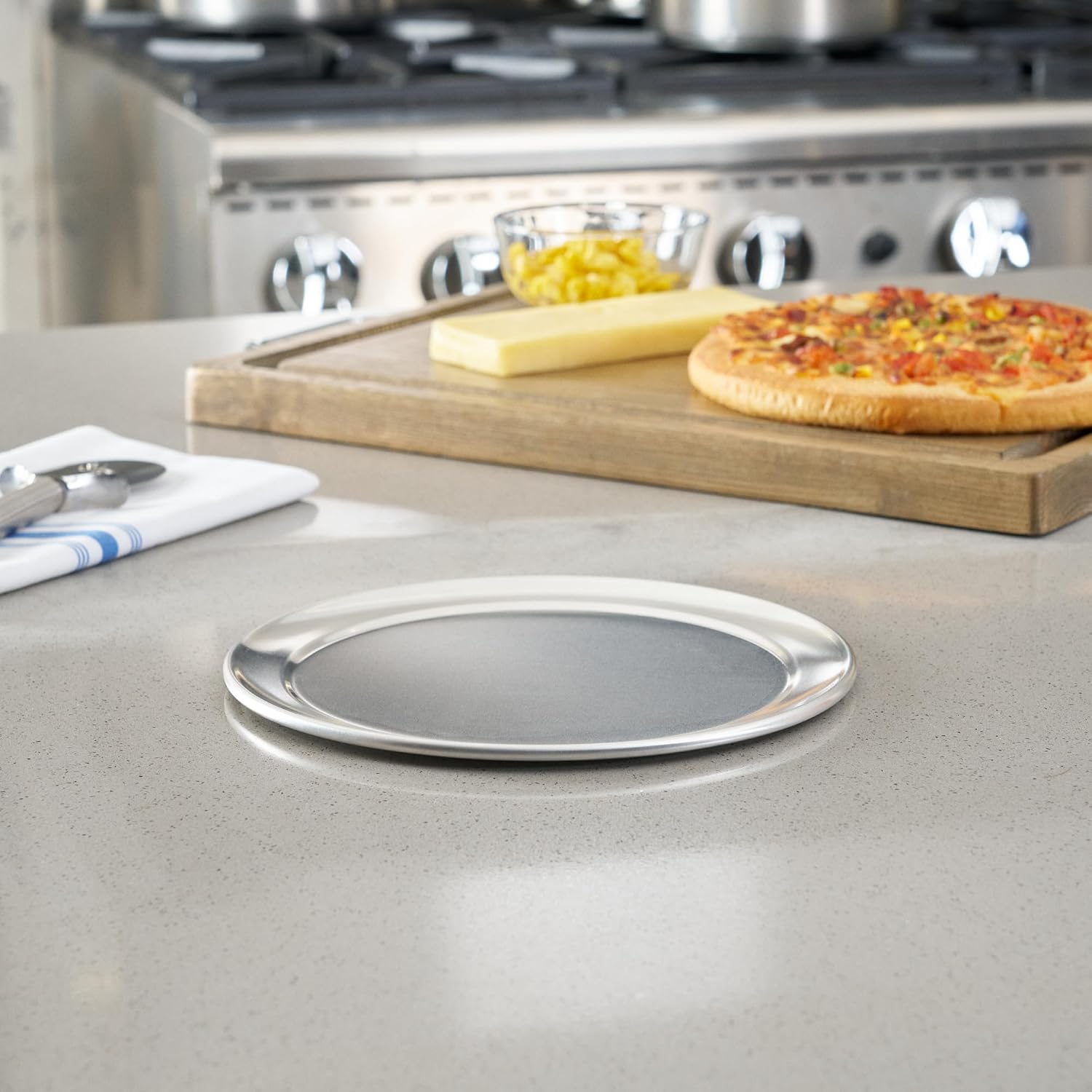 Restaurantware 9 Inch Aluminum Pizza Pan 144 Count Wide Rim Silver Pizza Pan, Heat Conductive Round Pizza Tray, Lightweight Corrosion-Resistant Serving Tray For Restaurant Or Home Use