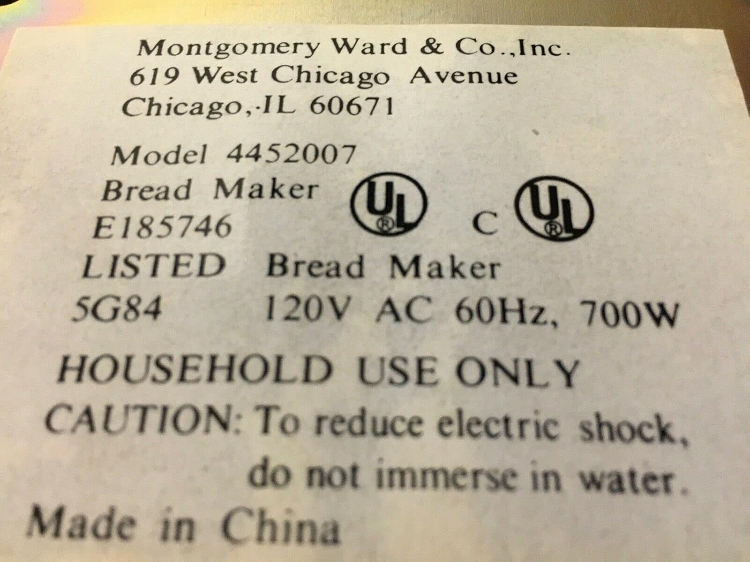 Product label showing 'Montgomery Ward & Co., Inc.', 'Model 4452007', 'Bread Maker', '120V AC 60Hz, 700W', and 'HOUSEHOLD USE ONLY'.