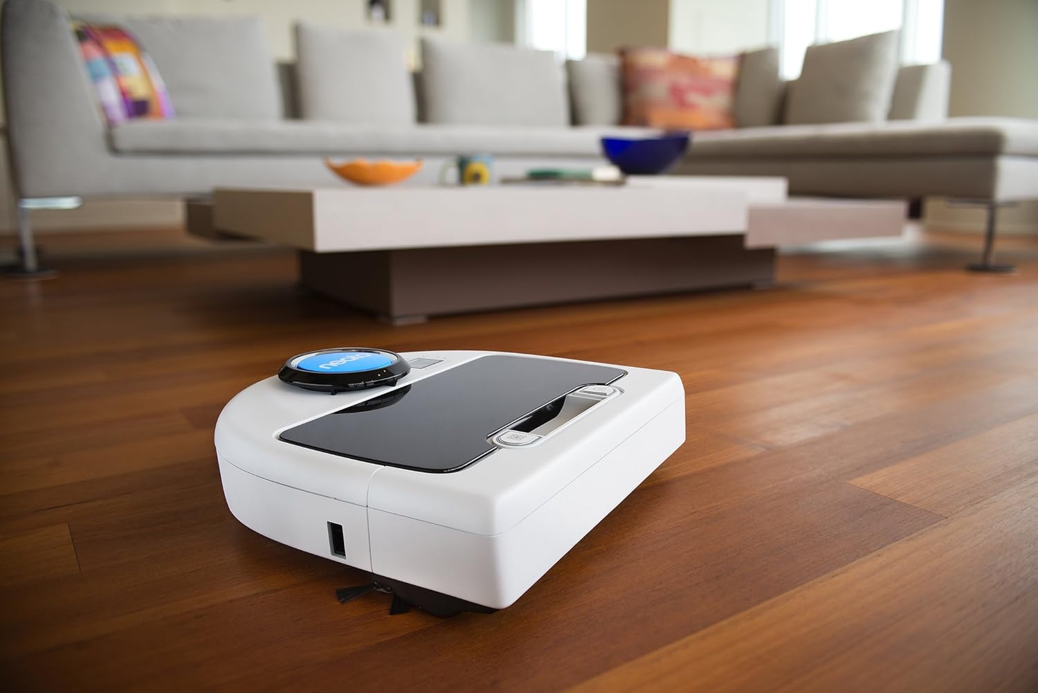Neato Botvac D Series Robot Vacuum charging at its base