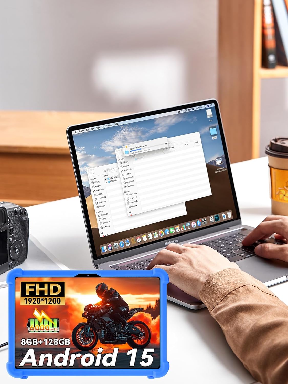Headwolf W6 tablet inside the UYRUREL case, displaying a vibrant screen with a motorcycle image, next to a laptop.