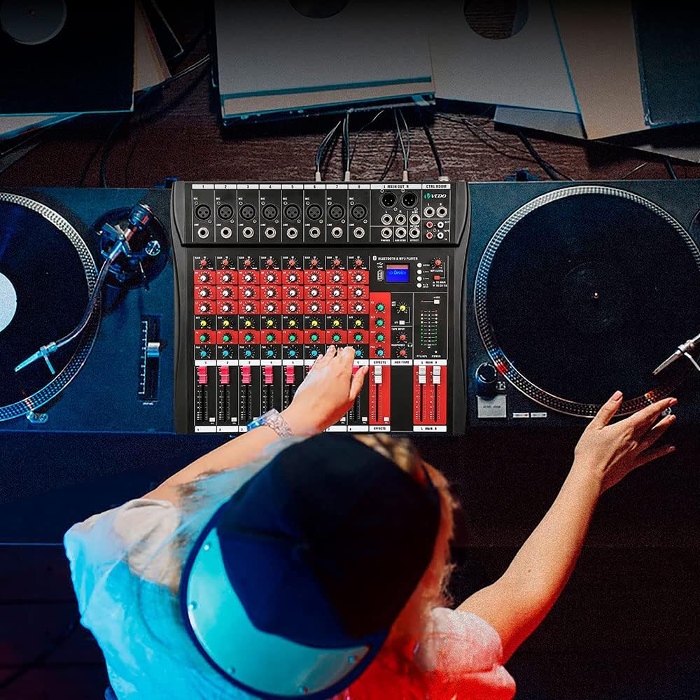 Person operating the Vedo VDA208L mixer with turntables