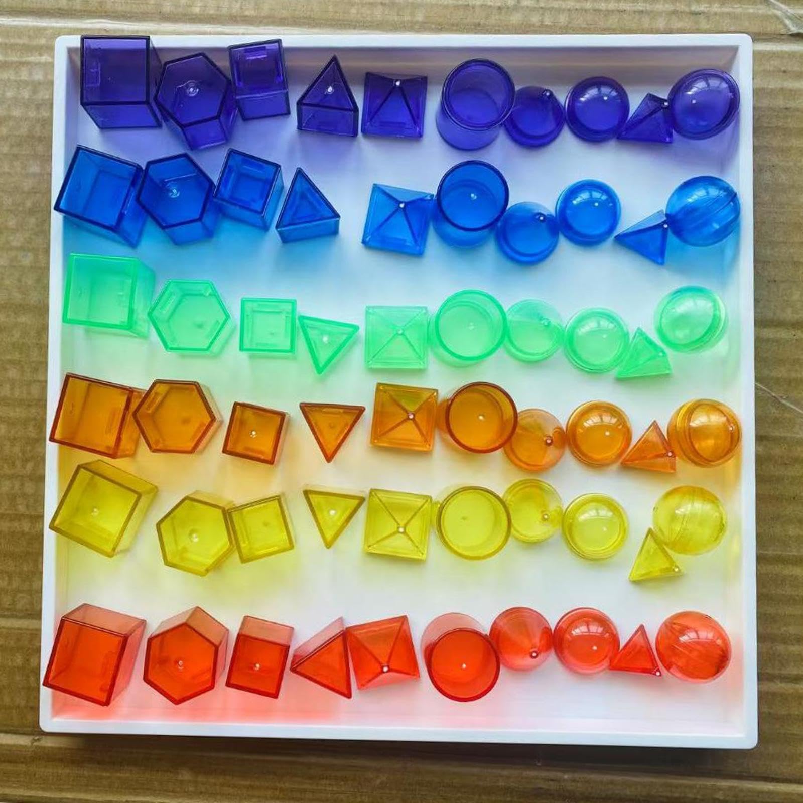 Qianly 100 Bloques Geométricos Translúcidos con Patrones para Niños. Material Didáctico Colorido para Profesores.