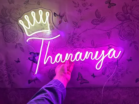 A stylish LED neon sign adds a modern Pinterest-inspired touch to the room while creating a soft ambient glow.
