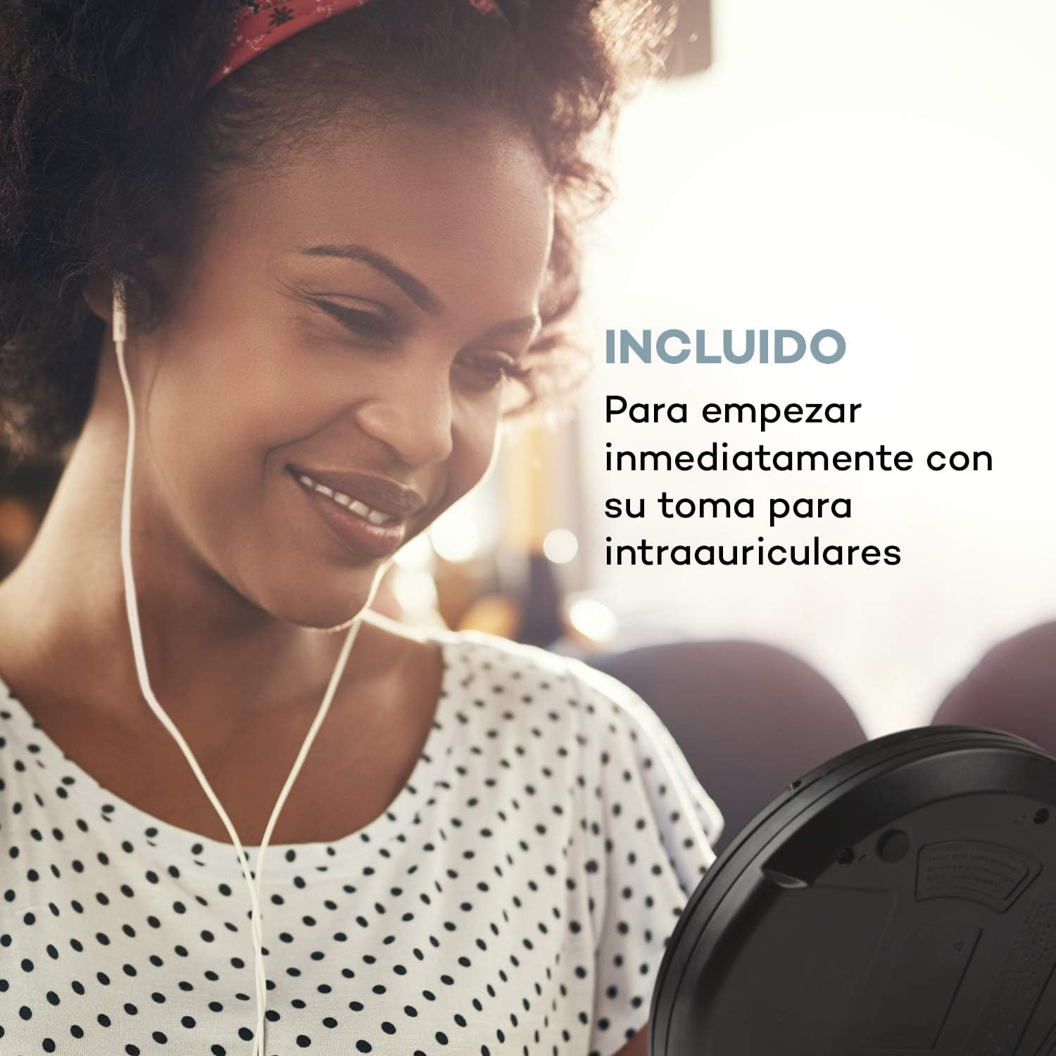 Woman listening to AUNA CDC 200 with included in-ear headphones
