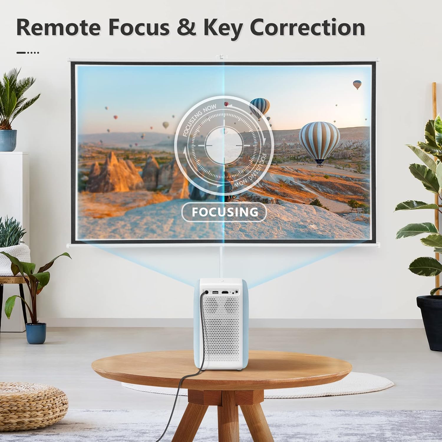 VIMGO P10 projector on a table, projecting an image onto a screen with a 'FOCUSING' overlay, demonstrating remote focus and key correction.