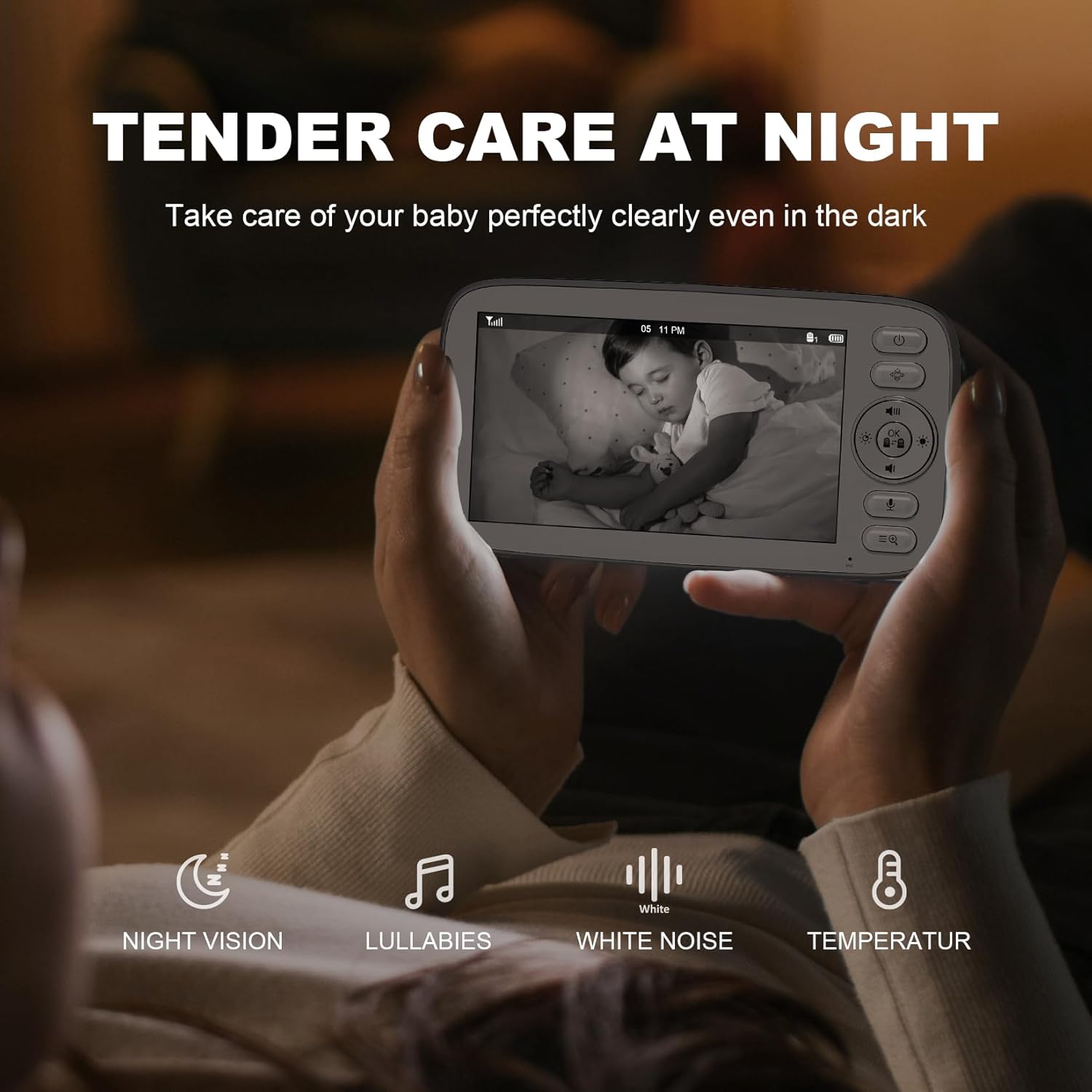 Hands holding monitor displaying baby sleeping in night vision mode