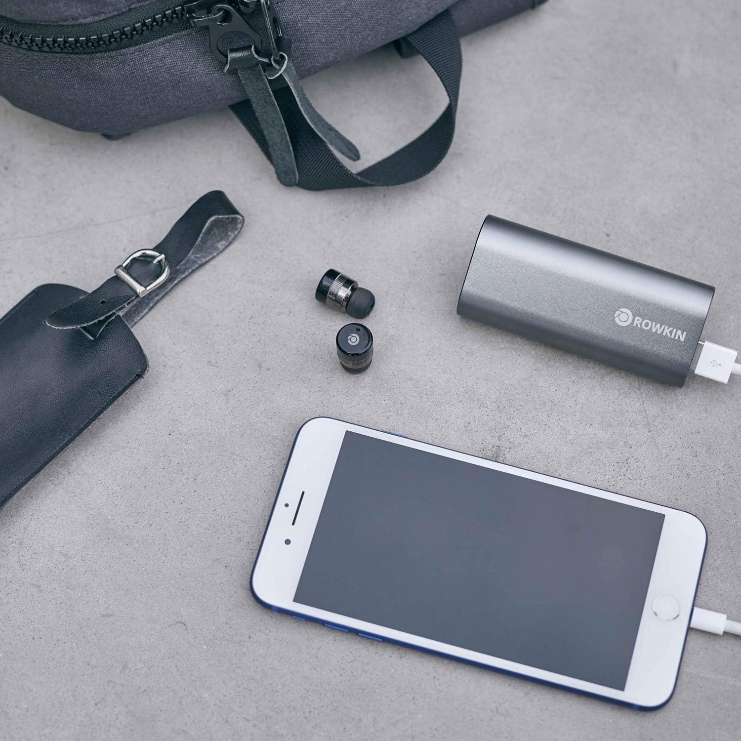 Rowkin Bit Charge Earbuds and Charging Case with phone