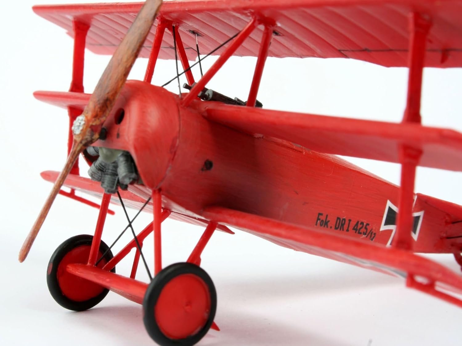 Front view of an assembled Revell Fokker Dr.1 Triplane model, showing propeller and landing gear