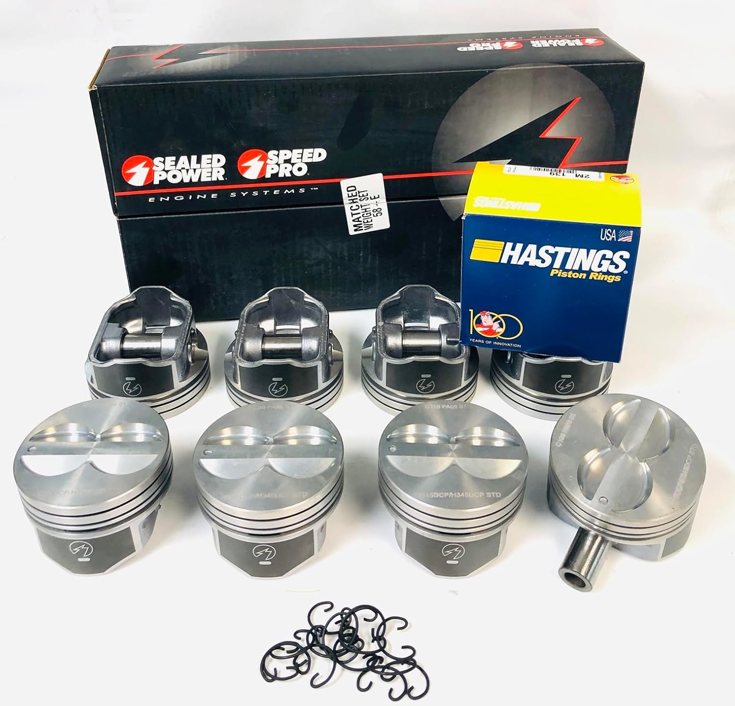 bundled set of (8) .030 over Hypereutectic Flat Top 4 Valve relief Pistons and matching Moly Rings with lock rings for floating rods compatible with 1968-85 Chevy 350 small blocks.