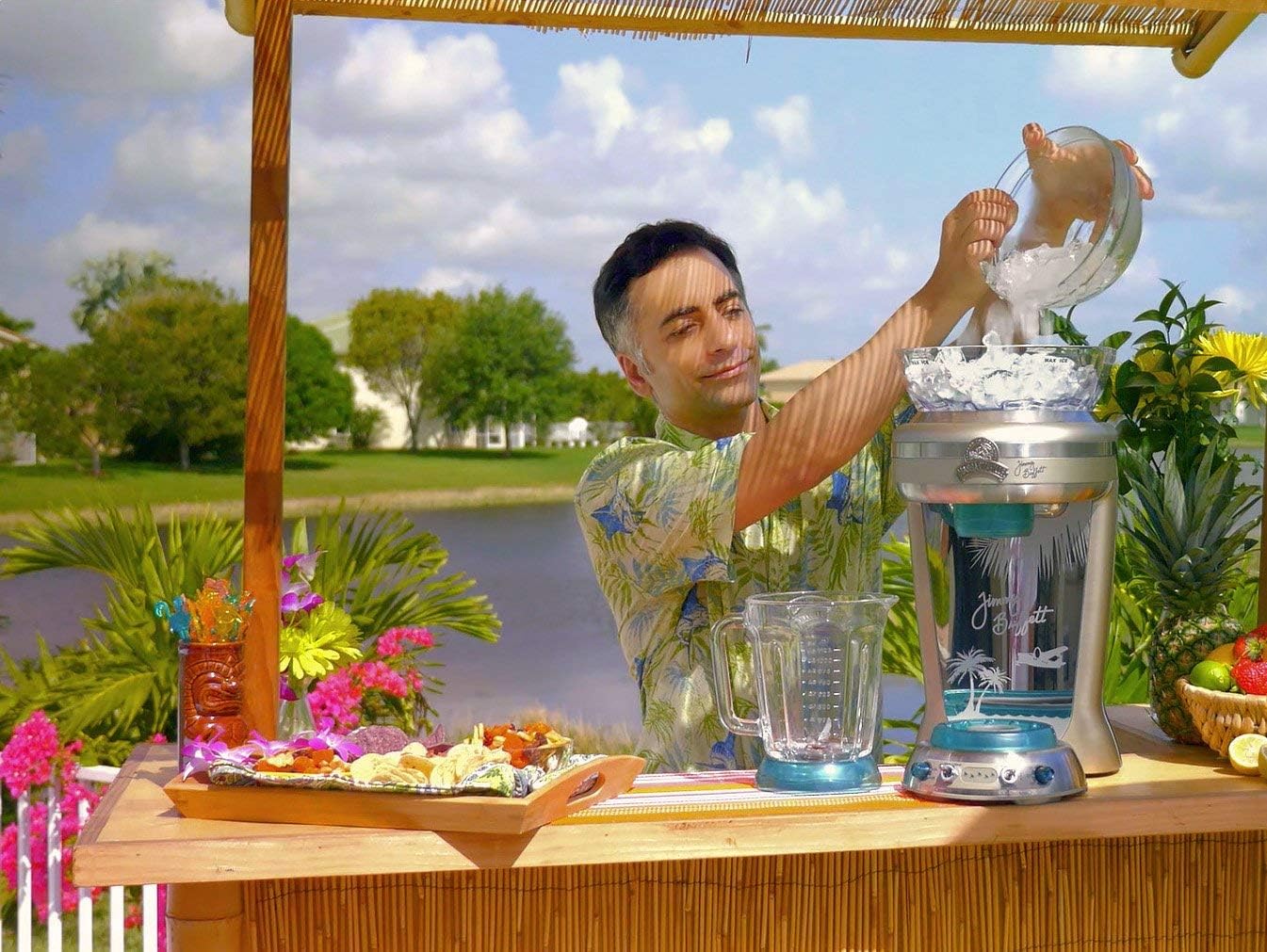 Person adding ice cubes to the ice reservoir of the Margaritaville Frozen Concoction Maker