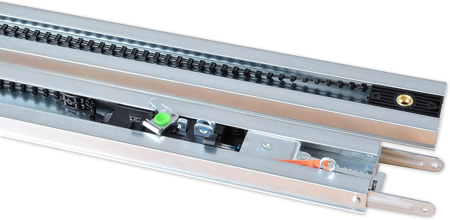 Primer pla view of the chain drive mechanism inside the K-rail of the garage door opener.