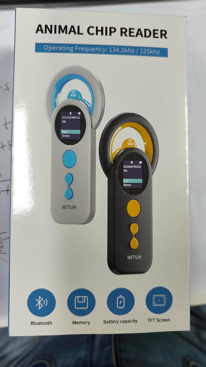 Veterinarian using the NETUM DJ-130 Pet Microchip Reader to scan a microchip on a cow's ear tag, demonstrating its multi-protocol compatibility.