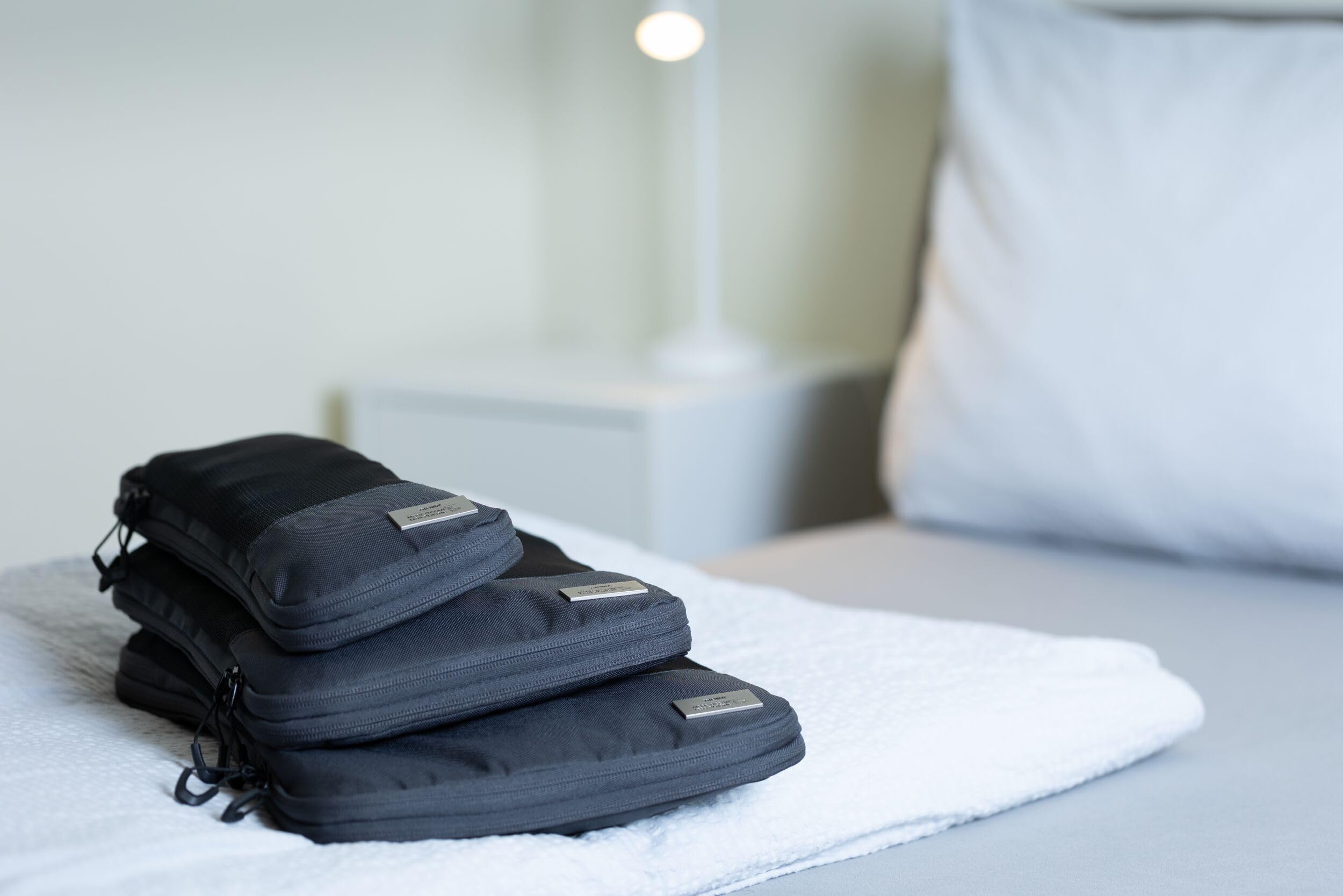 TROIKA Zestaw toreb kompresyjnych Blue CYCLE PACKING CUBES – 3 kieszenie z zamkiem błyskawicznym do oszczędzającego miejsce pakowania ubrań do walizki i plecaka – plastik morski z recyklingu –