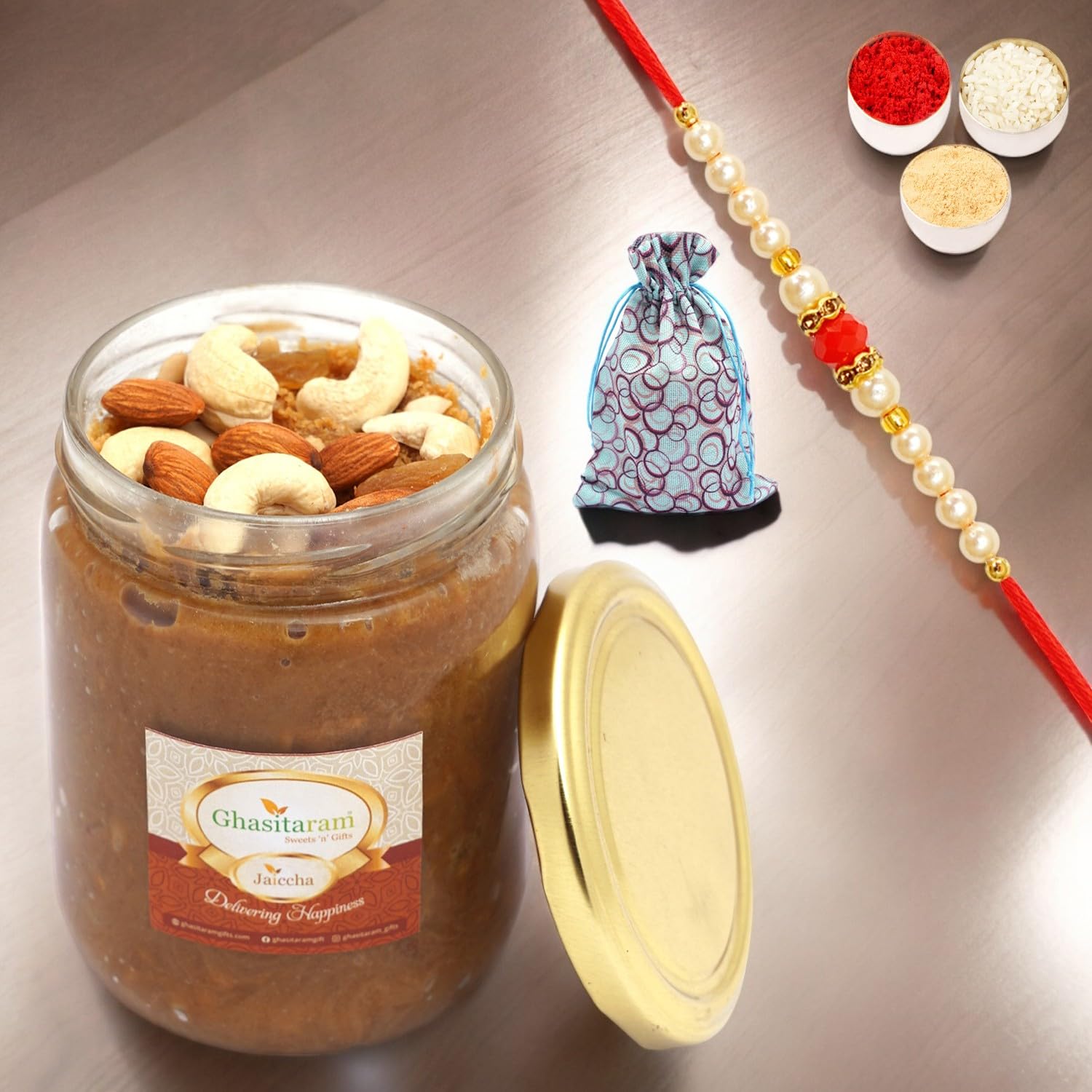 Ghasitaram Gifts Rakhi Gifts for Brothers Dryfruit Halwa in Potli with Pearl Beads Rakhi