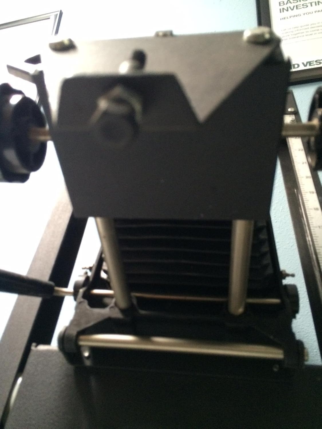 View from below the enlarger head, showing the lens mount area and bellows.