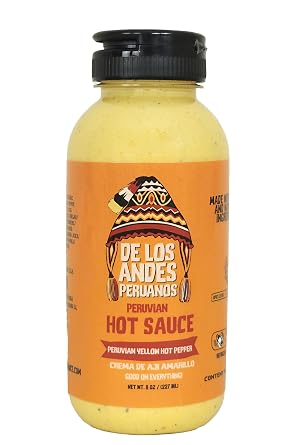 Aji de los Andes Peruanos Crema de Aji Amarillo 8.0 oz "Elevate your meals with the authentic taste of our Peruvian Yellow Hot Pepper Sauce. Crafted from handpicked Peruvian yellow hot peppers, our small-batch process ensures unmatched flavor and freshness. Experience the perfect balance of heat and sweetness in every drop. Versatile and natural, its your culinary essential for adding a touch of Peru to your dishes."