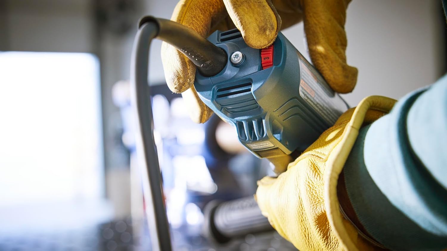BOSCH Angle Grinder in use, grinding metal