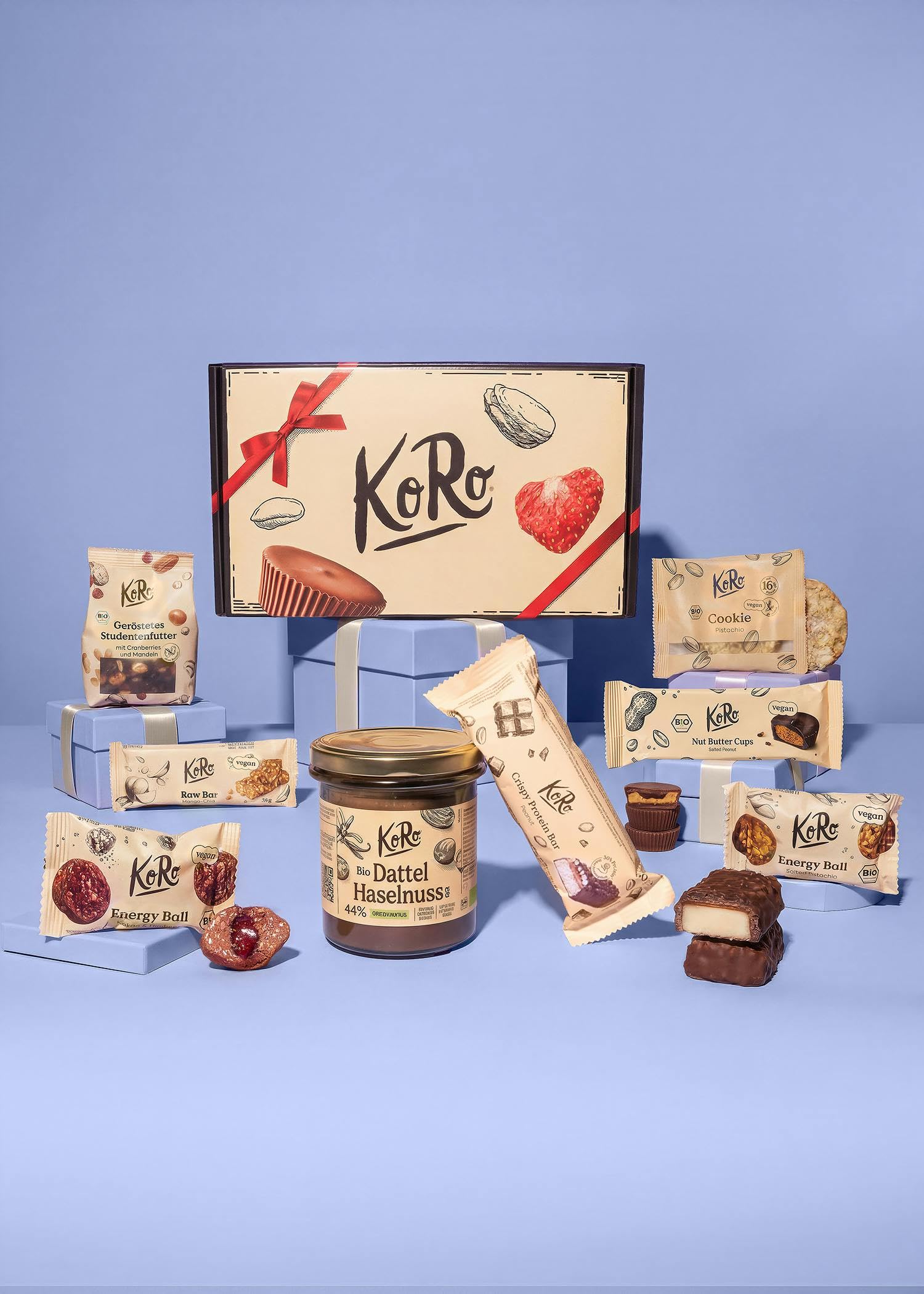 KoRo - KoRo Discovery Geschenkbox - Mit 8 vielseitigen KoRo-Leckereien -  Liebevoll gestaltetes Design - Ideal zum Verschenken oder Durchprobieren